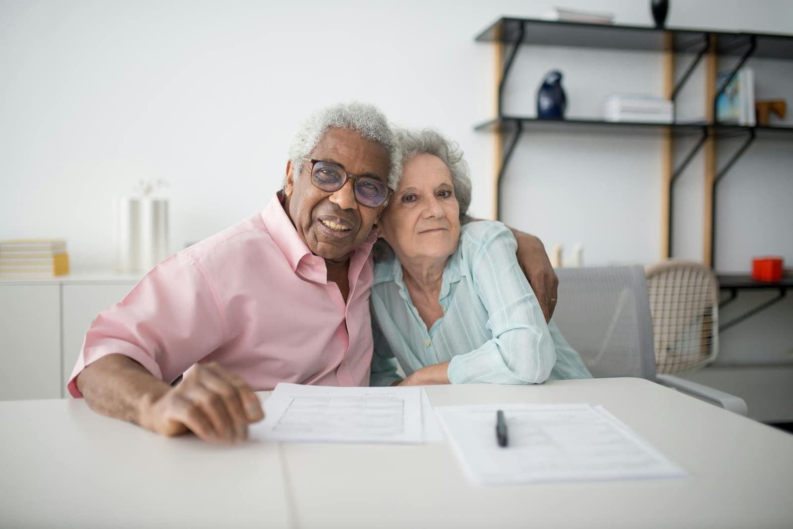 A couple reviewing their policy documents at the kitchen table