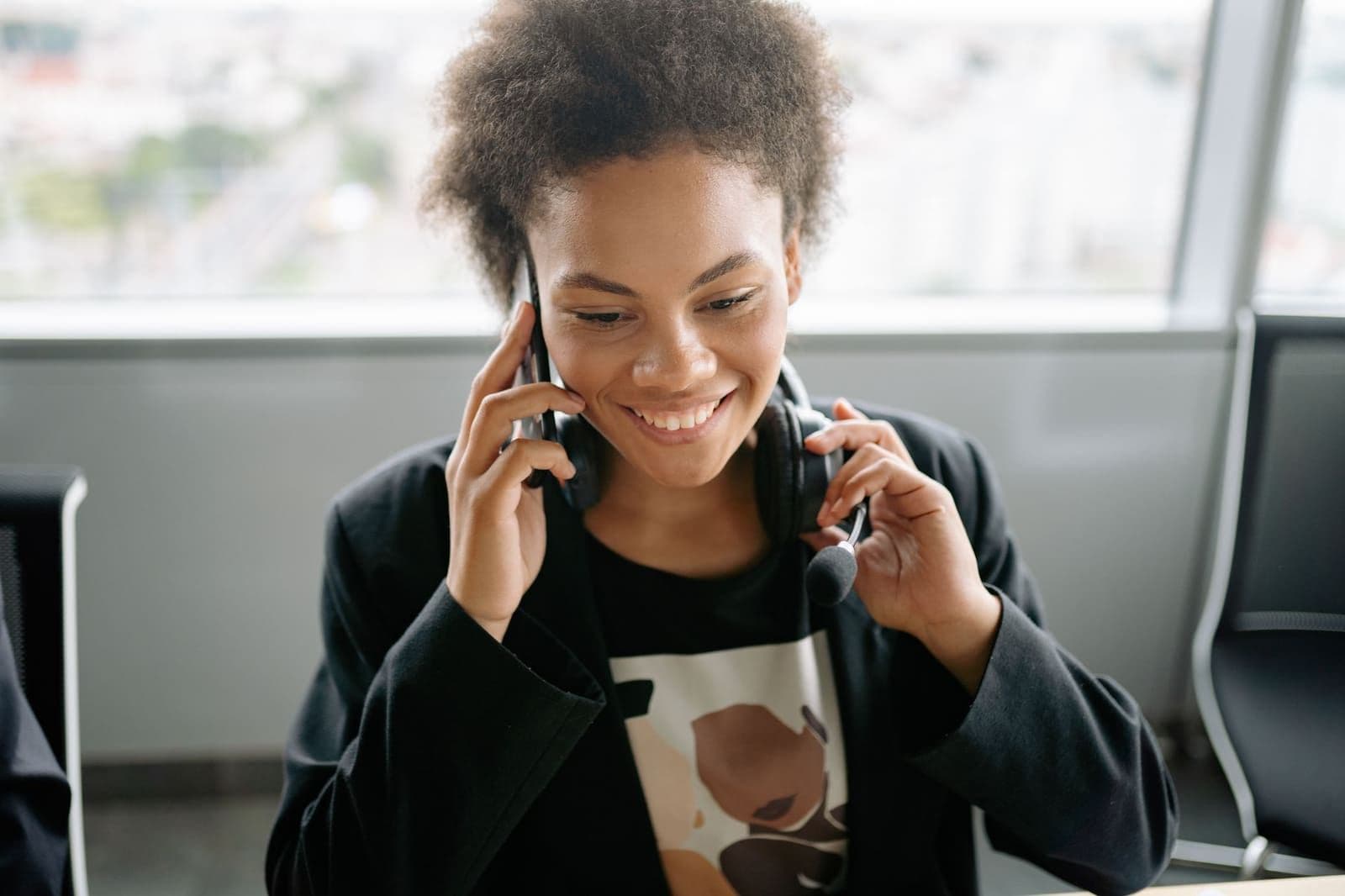 A professional helping a policyholder by phone